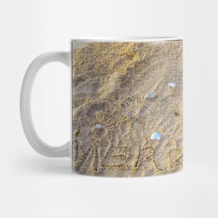 Merry Christmas letters in sand with Santa Claus on beach 2 Mug